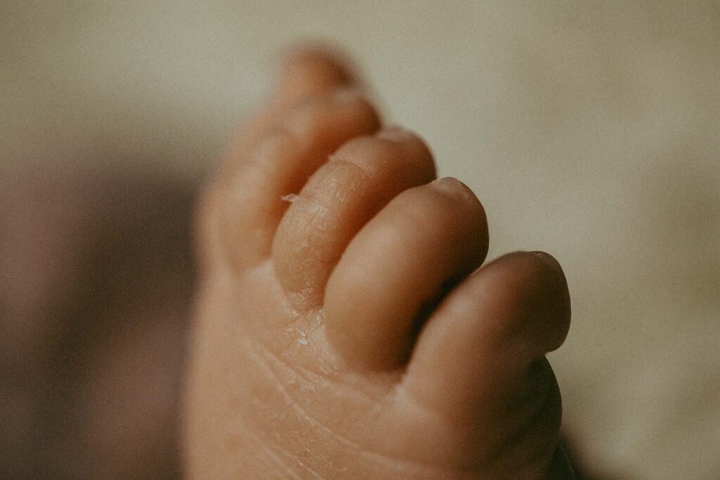 tiny toes of just born baby girl
