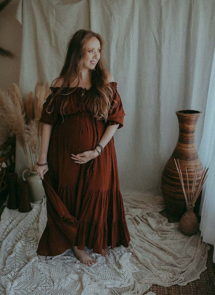 pregnant woman wears hazel and folk maxu dress in photo studio near doulas of raleigh
