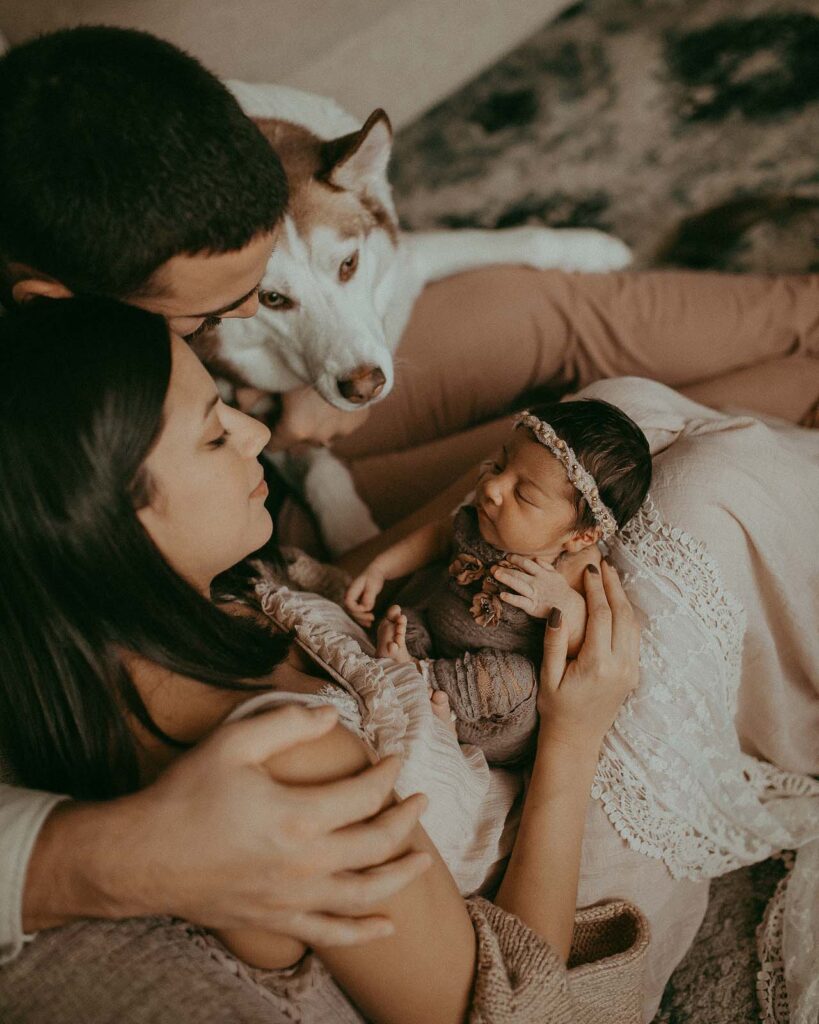 family with newborn baby girl and husky at home after delivery and Placenta Encapsulation Raleigh NC