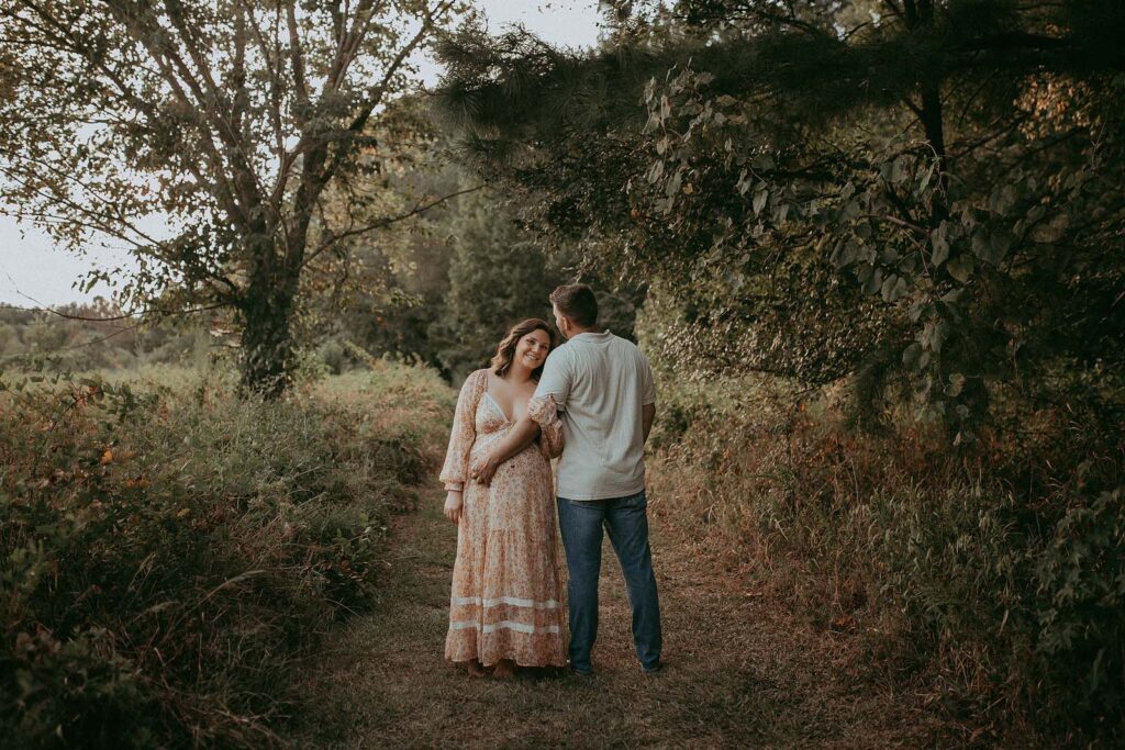 Victoria Vasilyeva Photography, your trusted Fayetteville Photographer, beautifully captures the essence of maternity. Dive into this outdoor session with a glowing mom-to-be and her husband.