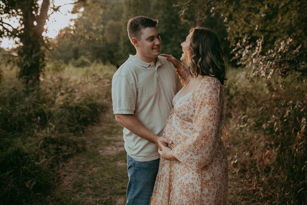 Capturing the beauty of a mom-to-be and her husband in an enchanting outdoor maternity session by Victoria Vasilyeva Photography.