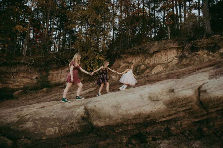 Beanstalk Durham fashion meets the natural beauty of Jordan Lake in this enchanting family portrait, crafted with precision by Victoria Vasilyeva Photography.