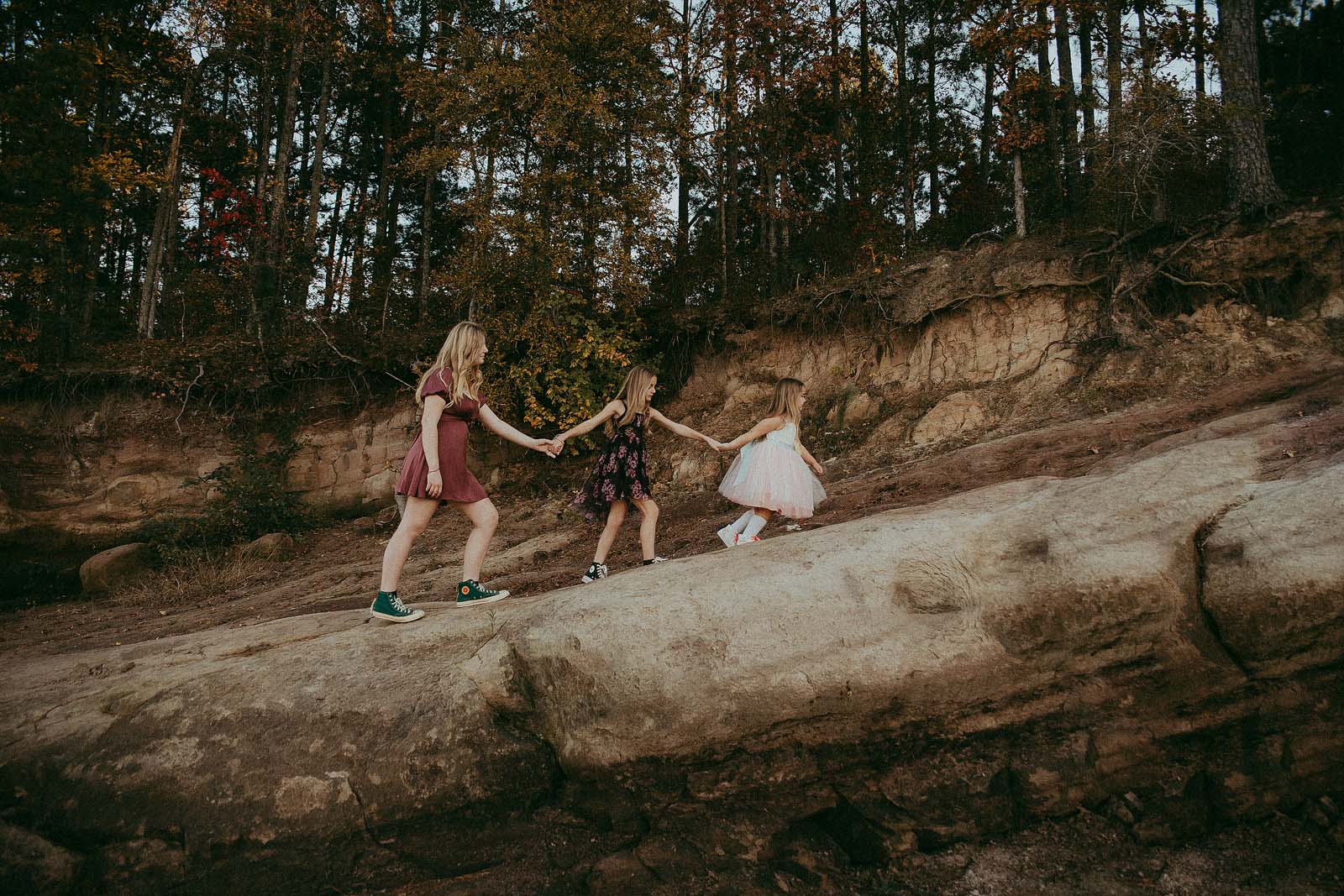 Beanstalk Durham fashion meets the natural beauty of Jordan Lake in this enchanting family portrait, crafted with precision by Victoria Vasilyeva Photography.