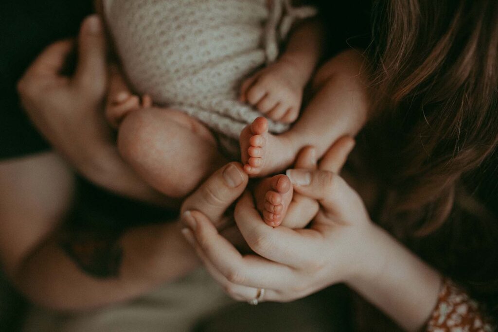 A newborn baby girl's tiny feet