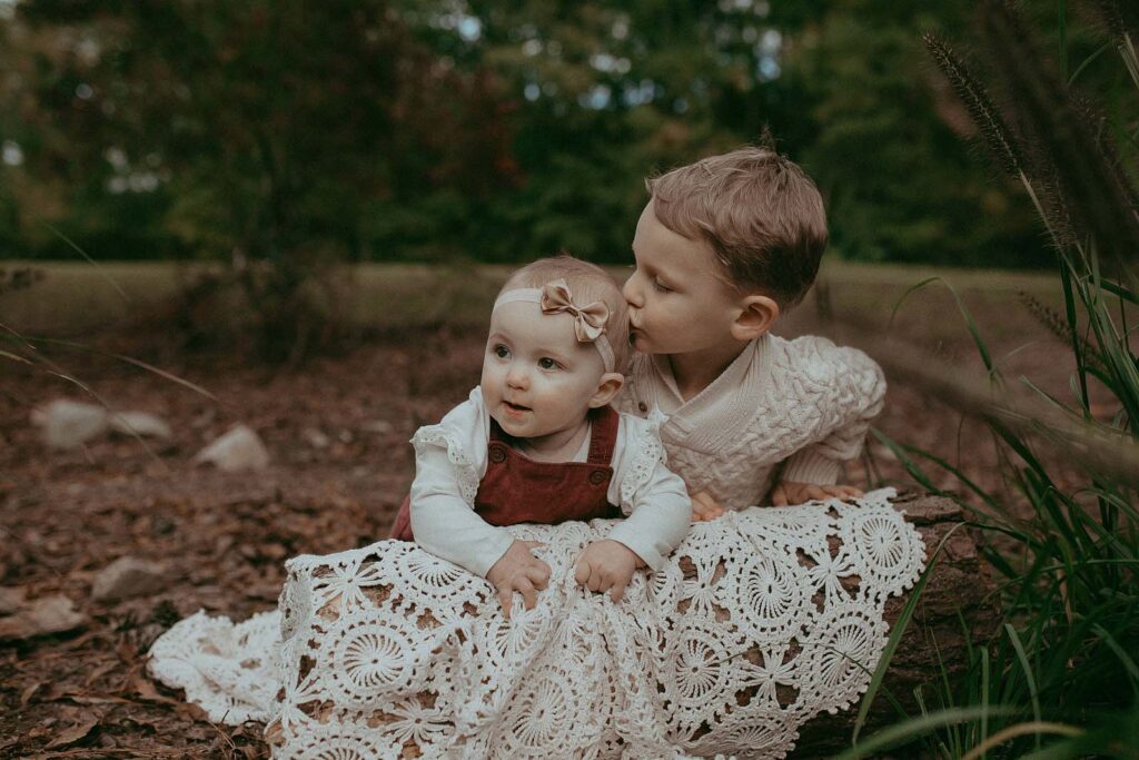 Brother and sister joyfully embrace the beauty of Benson Lake Park, creating lasting memories with the talent of Victoria Vasilyeva behind the lens.