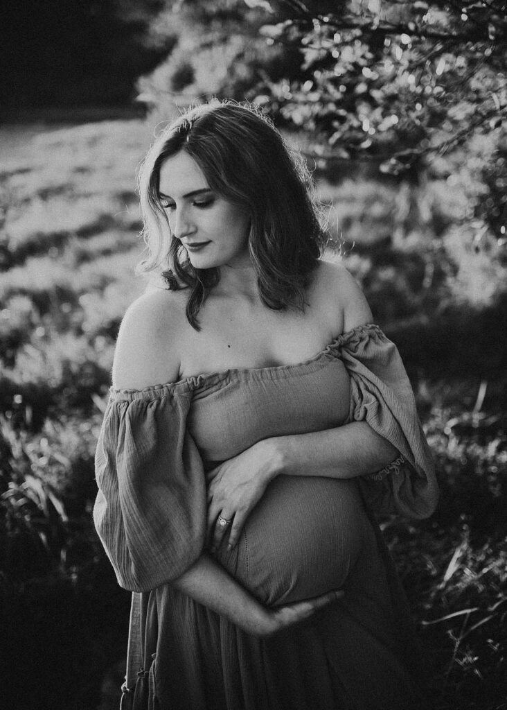 In this heartwarming maternity portrait at the Greensboro birthing center, Victoria Vasilyeva Photography beautifully documents the journey to parenthood, featuring a radiant mom-to-be.