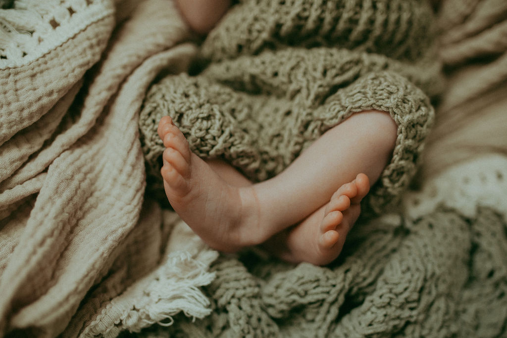 A newborn boy's toes - a precious memory forever etched in time. Captured by Holly Springs Newborn Photographer - Victoria Vasilyeva Photography.