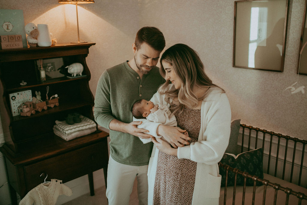 A playful exploration of a boho-themed nursery, filled with wonder and curiosity, captured by Holly Springs Newborn Photographer - Victoria Vasilyeva Photography.