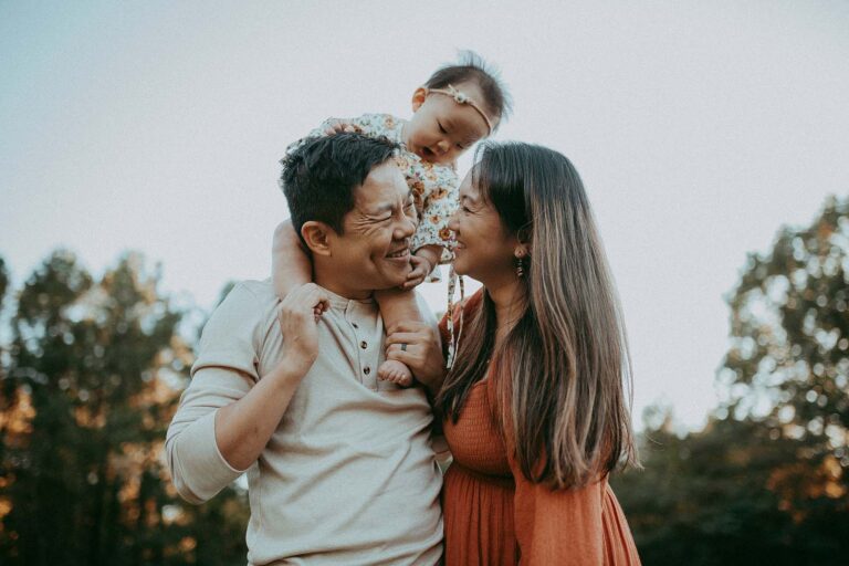 Joyful outdoor family session in Fayetteville by Victoria Vasilyeva Photography, featuring a stylish boho-clad family with their adorable 10-month-old.