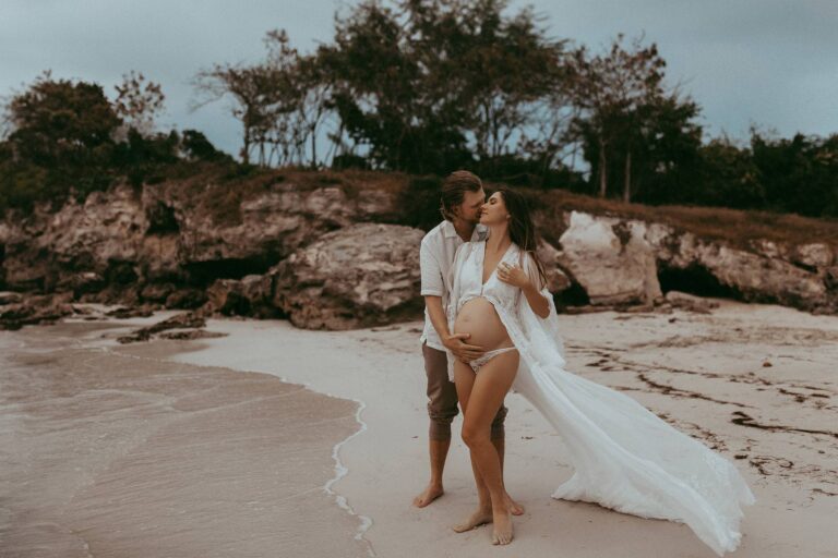 Beach maternity photo session with family on a beach. Victoria Vasilyeva Photography is one of the best maternity and family photographers in Wilmington, NC