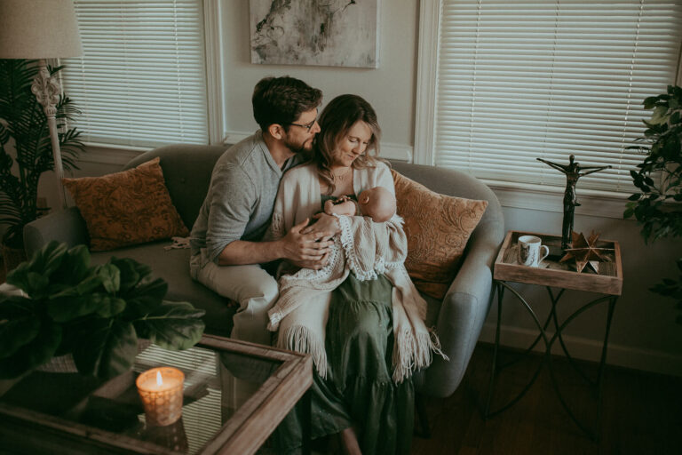 The portrait of family with his newborn baby boy. Newborn photography in Cary, NC. Victoria Vasilyeva Photography specializes in lifestyle photography, using natural light. Certified, insured, professional, safety. All outfits for baby, mom, and siblings are provided.