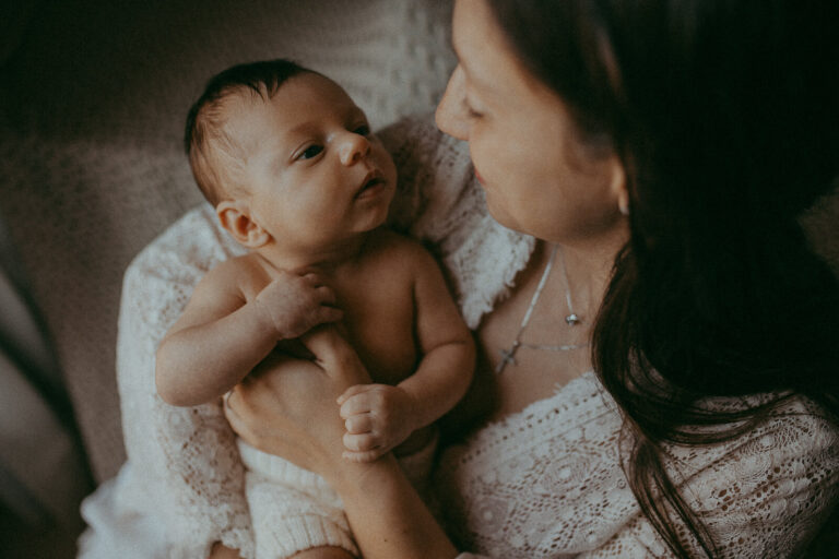 Victoria Vasilyeva Photography - Raleigh newborn photographer captures a tender moment between parents and their 20-day-old son Matthew.