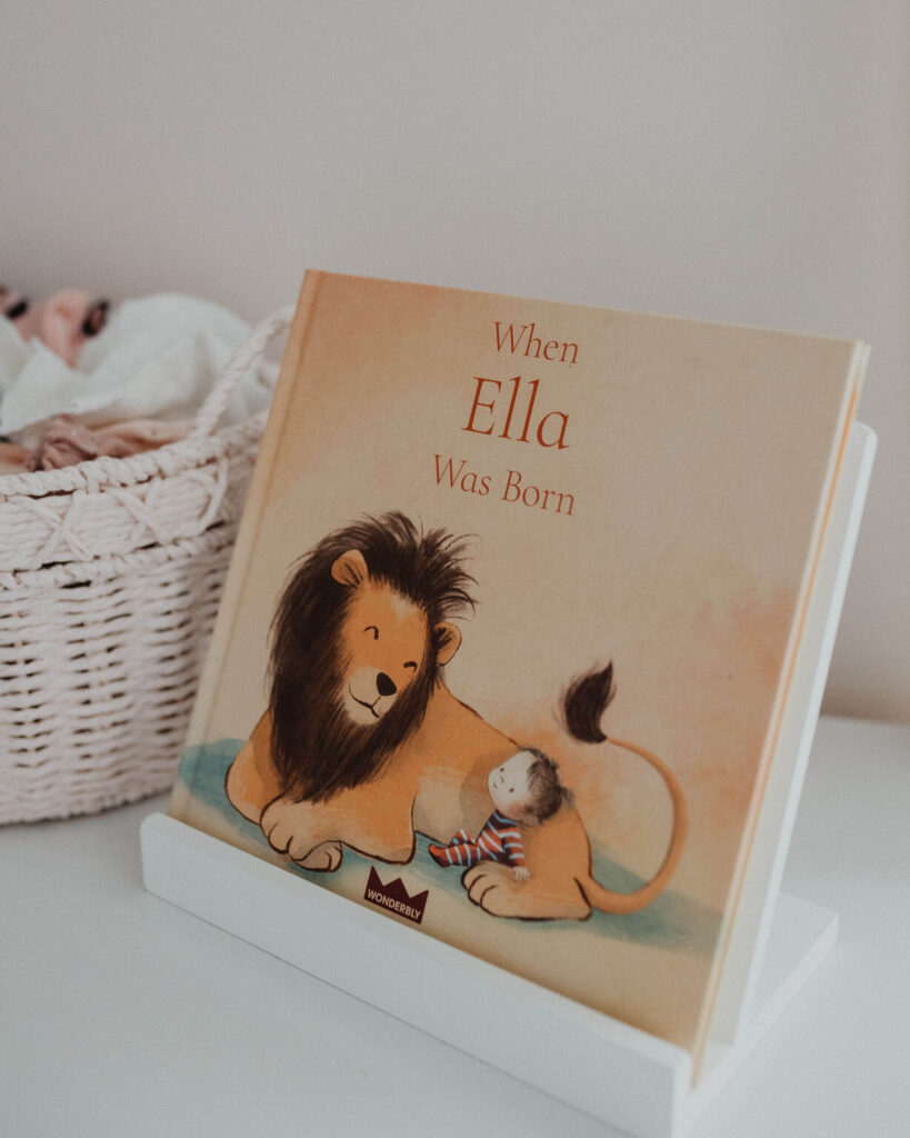 When Ella Was Born children's book displayed in the nursery during an in-home newborn photo session in Raleigh NC.