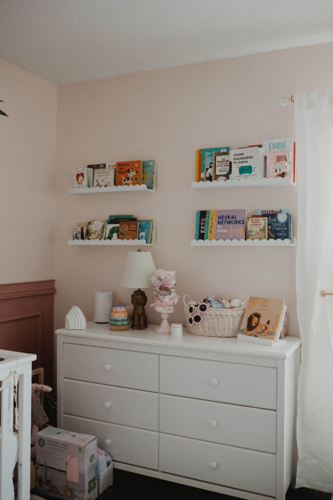 Soft pink baby girl nursery photographed during a lifestyle newborn photography session in Raleigh NC.