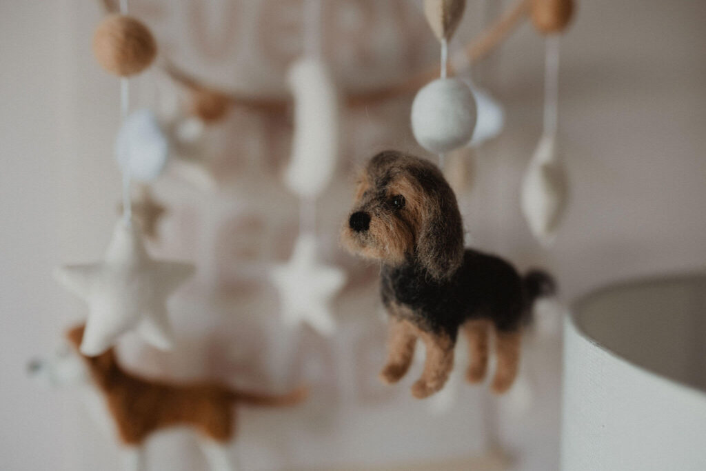 Handmade felt dog and animal mobile photographed as a nursery detail during an in-home newborn session by Victoria Vasilyeva Photography, newborn photographer in Raleigh NC.