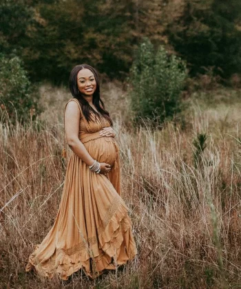 pregnant woman with long black hair in free people paradiso maxi dress in raleigh nc