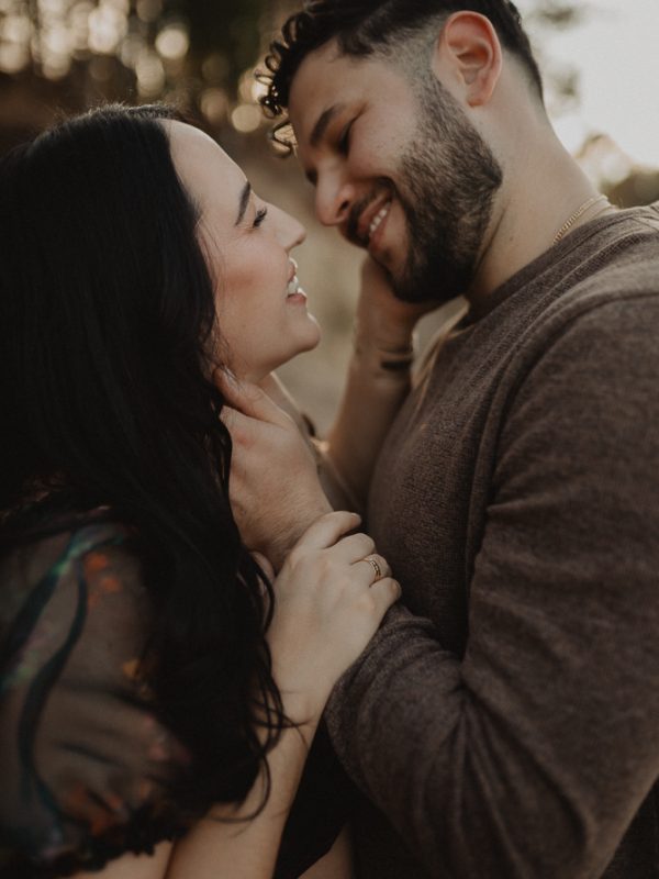 Intimate close-up maternity portrait of expecting parents embracing at golden hour, photographed by Victoria Vasilyeva Photography, maternity photographer serving Raleigh NC and surrounding areas.